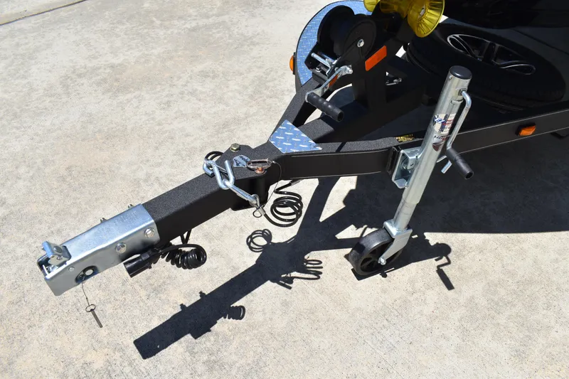 Slide: The Image of Trailer hitch and jack of 2026 Triton 179 TrX on concrete surface. - 47