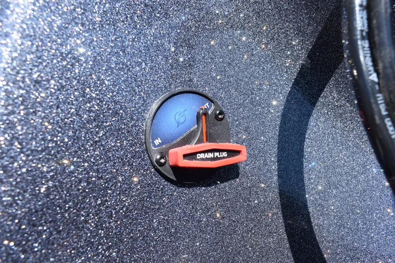 Slide: The Image of Close-up of 2026 Triton 179 TrX boat drain plug on a glittery surface. - 9