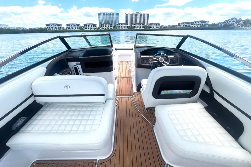 Slide: The Image of Luxurious 2017 Cobalt R30 boat interior with white seating and wooden flooring on a sunny day. - 15