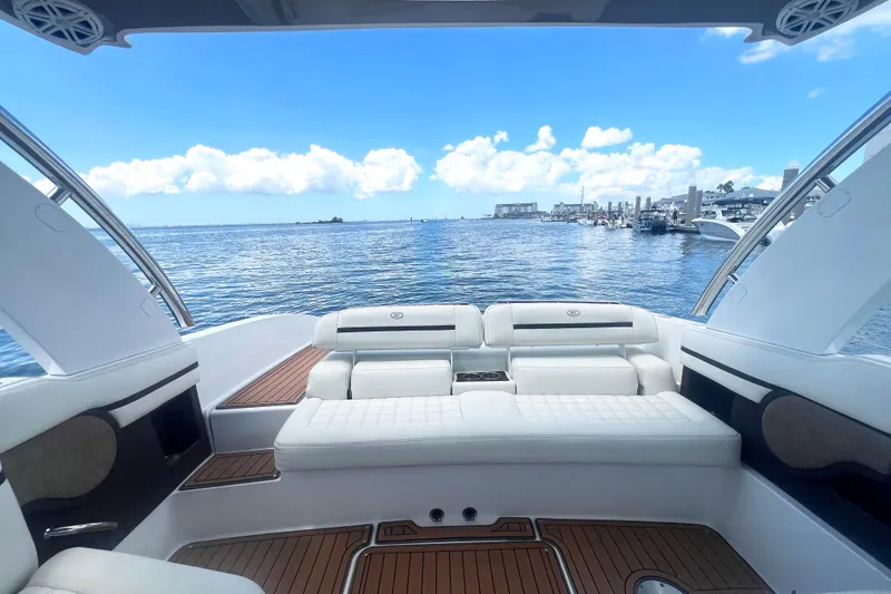 Slide: The Image of Luxurious 2017 Cobalt R30 boat interior with white seating, overlooking a scenic waterfront. - 23