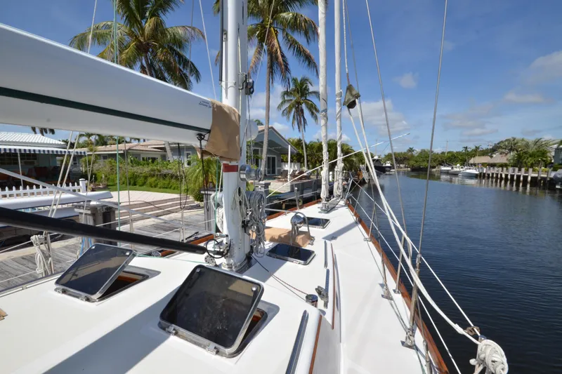 Slide: The Image of Hinckley Sou'wester 59 sailboat docked by palm trees, sunny day, 1992 model. - 14