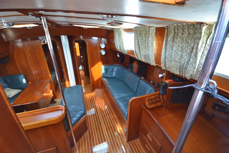 Slide: The Image of Luxurious interior of 1992 Hinckley Sou'wester 59 yacht with polished wood and leather seating. - 21