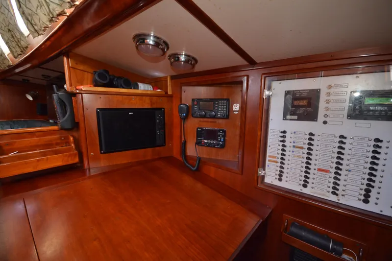 Slide: The Image of Navigation station of 1992 Hinckley Sou'wester 59 yacht with control panels and equipment. - 23