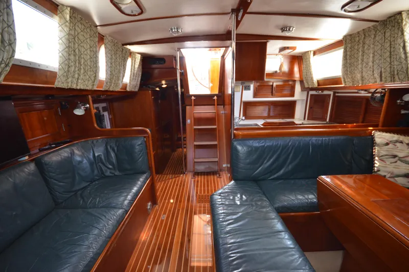 Slide: The Image of Luxurious interior of a 1992 Hinckley Sou'wester 59 yacht with elegant wood finishes. - 26