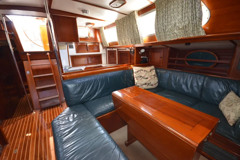 Slide: The Image of Luxurious interior of a 1992 Hinckley Sou'wester 59 yacht with elegant wood finishes. - 27