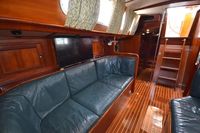 Slide: The Image of Luxurious interior of 1992 Hinckley Sou'wester 59 yacht with leather seating and wooden finishes. - 28