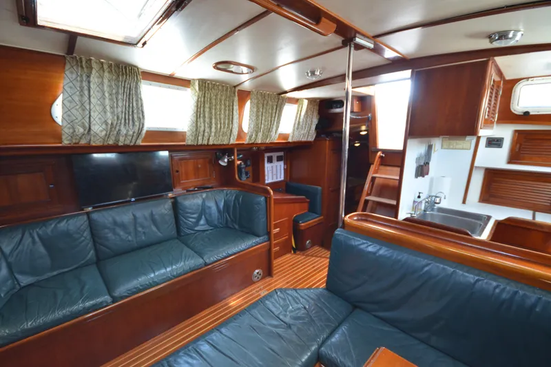Slide: The Image of Interior of 1992 Hinckley Sou'wester 59 yacht with wood finish and leather seating. - 29