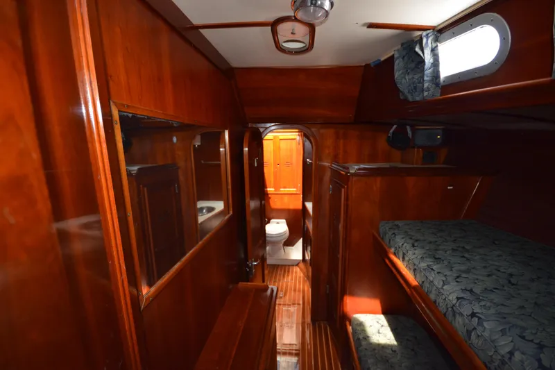 Slide: The Image of Interior of 1992 Hinckley Sou'wester 59 yacht with wooden finishes and bunk beds. - 37