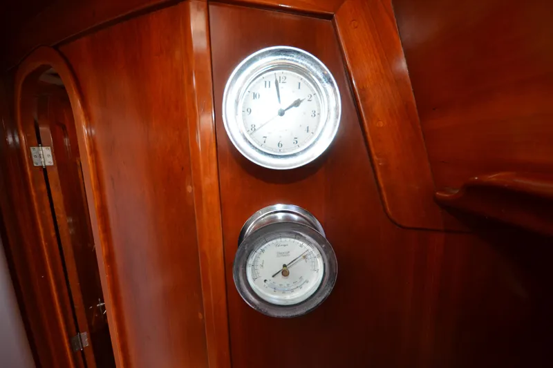 Slide: The Image of Wooden interior with clock and barometer on 1992 Hinckley Sou'wester 59 yacht. - 47