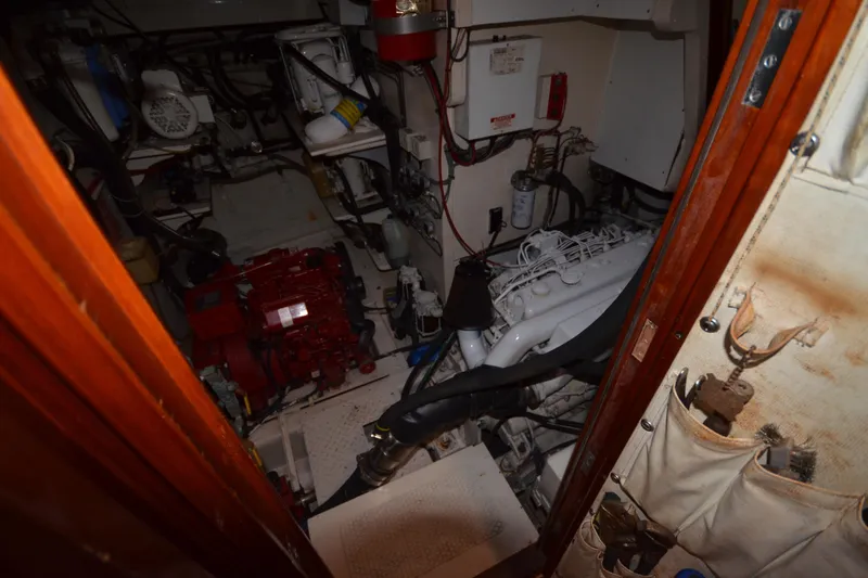 Slide: The Image of Engine room of a 1992 Hinckley Sou'wester 59 sailboat, showcasing mechanical components. - 55