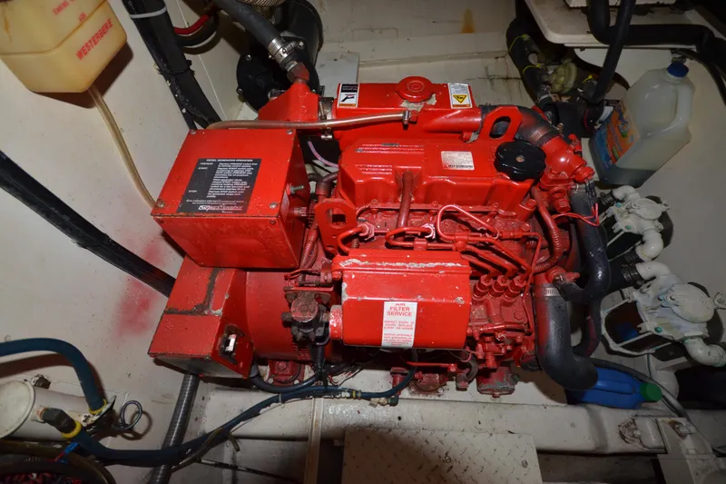 Slide: The Image of Engine room of 1992 Hinckley Sou'wester 59 yacht with red marine engine. - 58