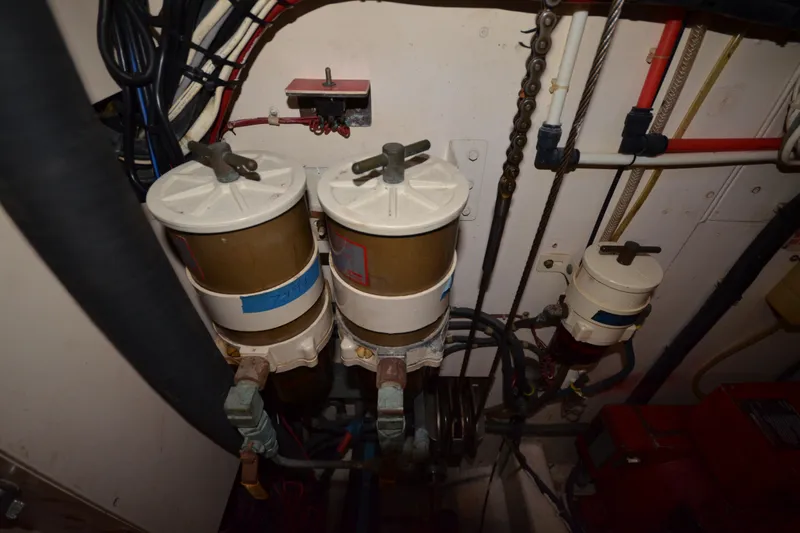 Slide: The Image of Engine room of 1992 Hinckley Sou'wester 59 yacht with fuel filters and wiring. - 59