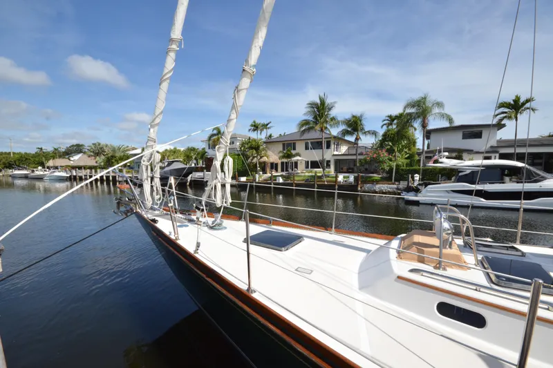Slide: The Image of Sailing yacht Hinckley Sou'wester 59, 1992 model, docked in a sunny marina. - 6