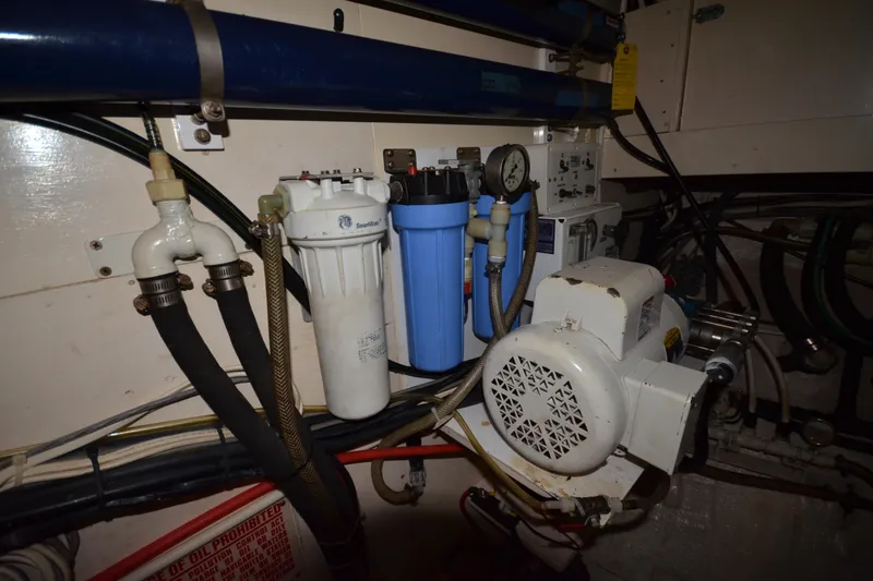Slide: The Image of Engine room of 1992 Hinckley Sou'wester 59 yacht with filtration system and machinery. - 61