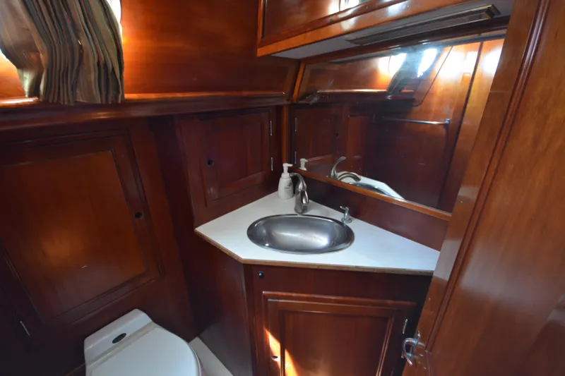 Slide: The Image of Luxurious wooden bathroom interior of 1992 Hinckley Sou'wester 59 yacht. - 62
