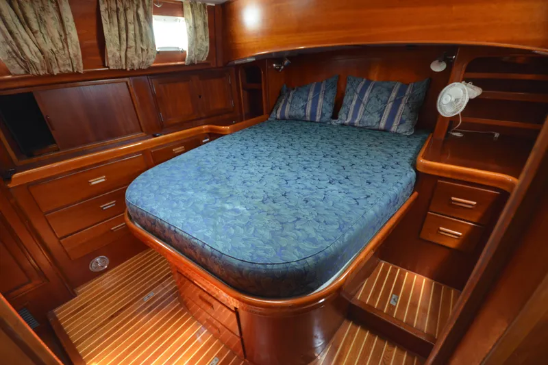 Slide: The Image of Luxurious cabin interior of 1992 Hinckley Sou'wester 59 yacht with wooden furnishings. - 63