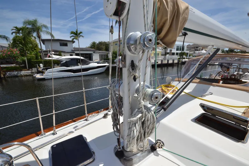Slide: The Image of Sailboat deck view of 1992 Hinckley Sou'wester 59, docked near waterfront homes. - 64