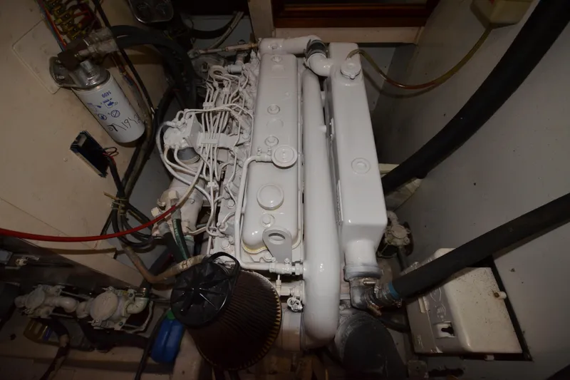 Slide: The Image of Engine room of 1992 Hinckley Sou'wester 59 sailboat, showcasing detailed mechanical components. - 72