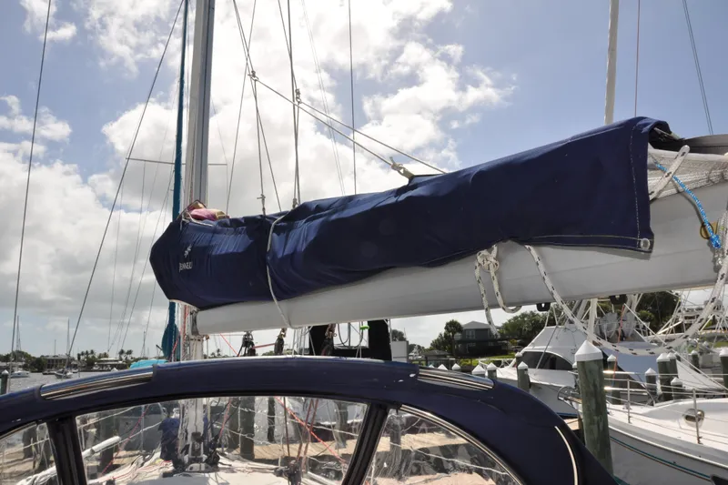 Slide: The Image of Jeanneau Sun Odyssey 36i sailboat docked, mast and boom covered, 2010 model. - 10