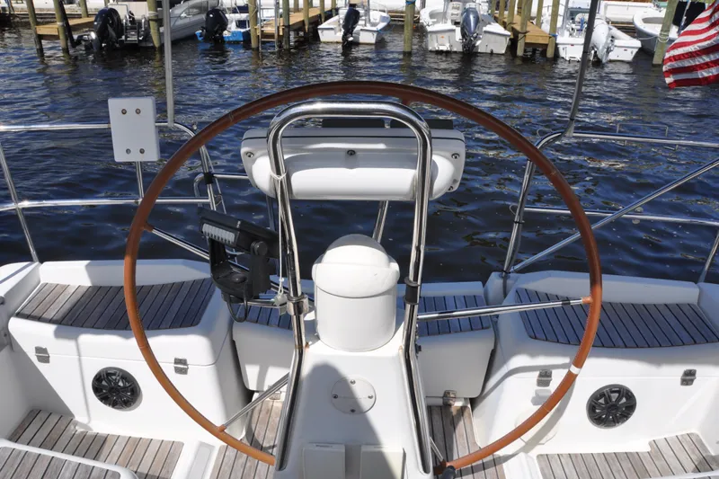 Slide: The Image of Cockpit of 2010 Jeanneau Sun Odyssey 36i sailboat with wooden steering wheel. - 14