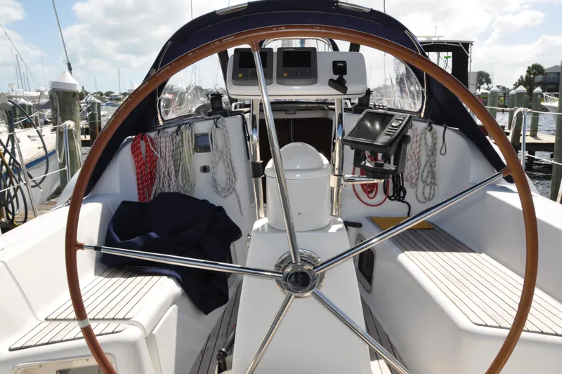 Slide: The Image of Cockpit of 2010 Jeanneau Sun Odyssey 36i sailboat with steering wheel and navigation equipment. - 15