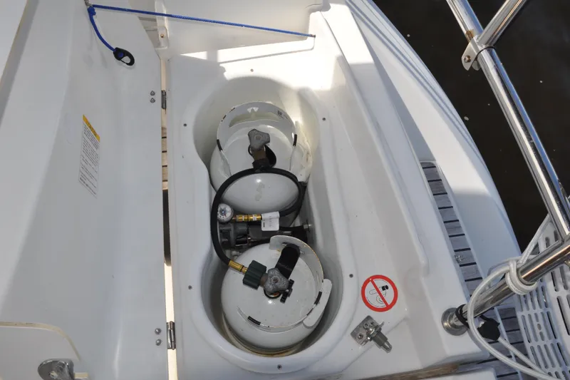 Slide: The Image of Storage compartment with gas cylinders on a 2010 Jeanneau Sun Odyssey 36i sailboat. - 22