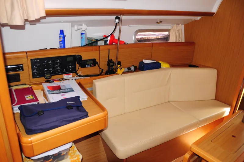 Slide: The Image of Interior of 2010 Jeanneau Sun Odyssey 36i yacht with navigation station and seating area. - 25