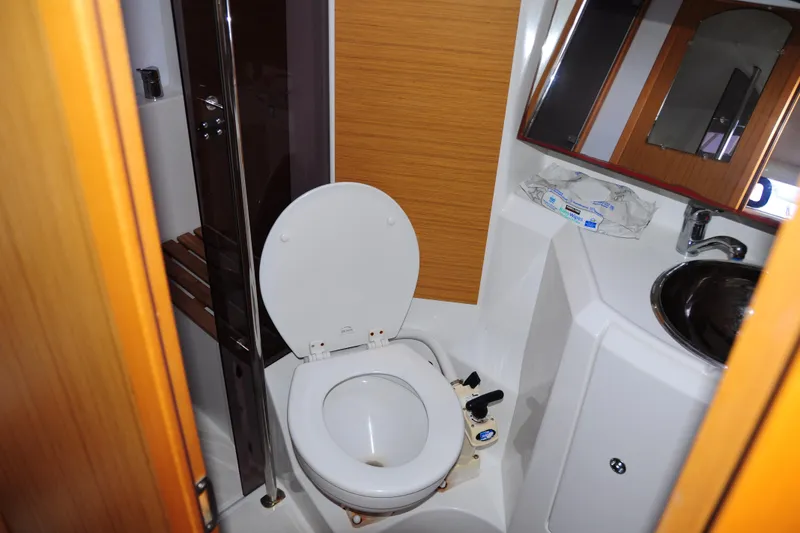 Slide: The Image of Bathroom interior of 2010 Jeanneau Sun Odyssey 36i yacht, featuring toilet and sink. - 44