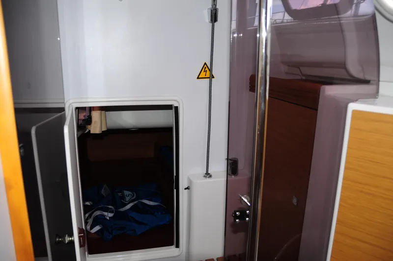 Slide: The Image of Interior view of 2010 Jeanneau Sun Odyssey 36i sailboat cabin with storage compartment. - 46