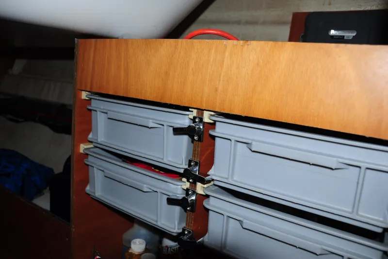 Slide: The Image of Storage compartments inside a 2010 Jeanneau Sun Odyssey 36i sailboat cabin. - 49