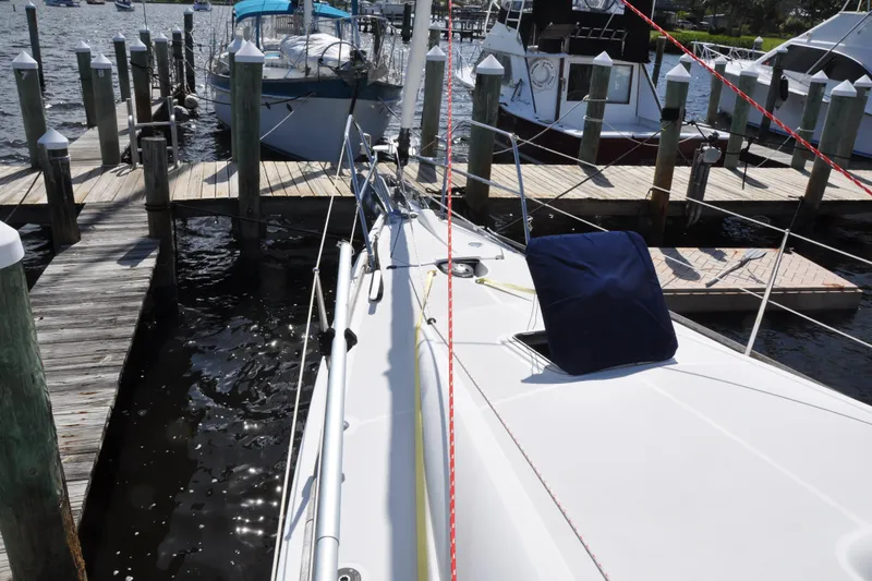 Slide: The Image of Jeanneau Sun Odyssey 36i 2010 docked, serene harbor view. - 5