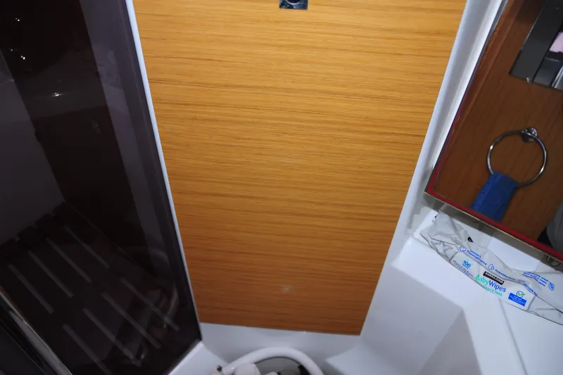 Slide: The Image of Interior of 2010 Jeanneau Sun Odyssey 36i yacht bathroom with wooden paneling. - 52