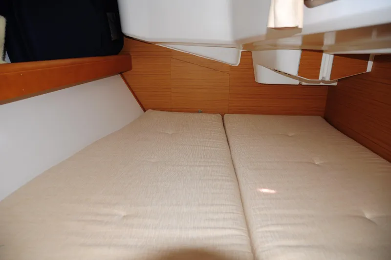 Slide: The Image of Interior cabin of 2010 Jeanneau Sun Odyssey 36i sailboat with beige cushions. - 56