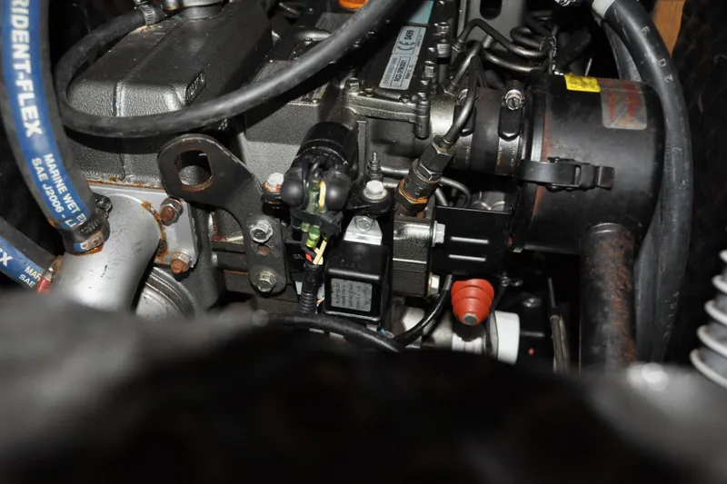 Slide: The Image of Engine components of a 2010 Jeanneau Sun Odyssey 36i sailboat, showcasing detailed mechanical parts. - 65
