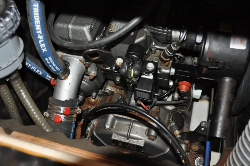 Slide: The Image of Engine compartment of a 2010 Jeanneau Sun Odyssey 36i sailboat, showcasing mechanical components. - 66