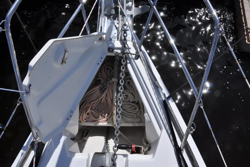 Slide: The Image of Open anchor locker on Jeanneau Sun Odyssey 36i sailboat, showing ropes and chain. - 7