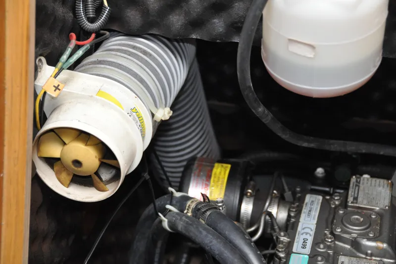 Slide: The Image of Engine compartment of 2010 Jeanneau Sun Odyssey 36i sailboat, featuring ventilation and mechanical components. - 74