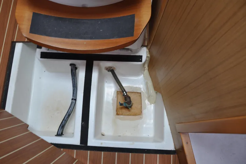 Slide: The Image of Interior view of a 2010 Jeanneau Sun Odyssey 36i sailboat, showing plumbing components. - 75