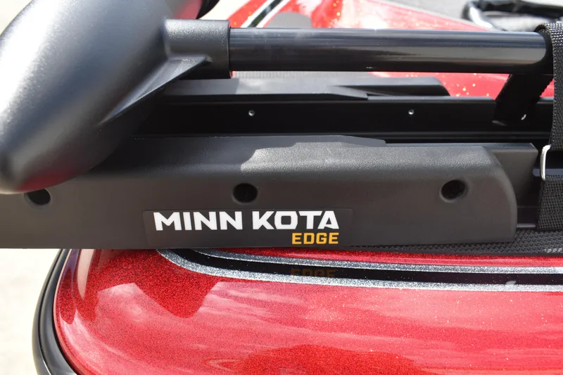 Slide: The Image of Minn Kota Edge trolling motor on 2026 Triton 18 TrX boat, red finish. - 12