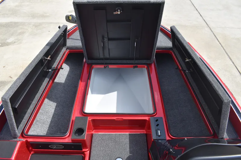 Slide: The Image of Storage compartments on a 2026 Triton 18 TrX boat, featuring red and gray design. - 15