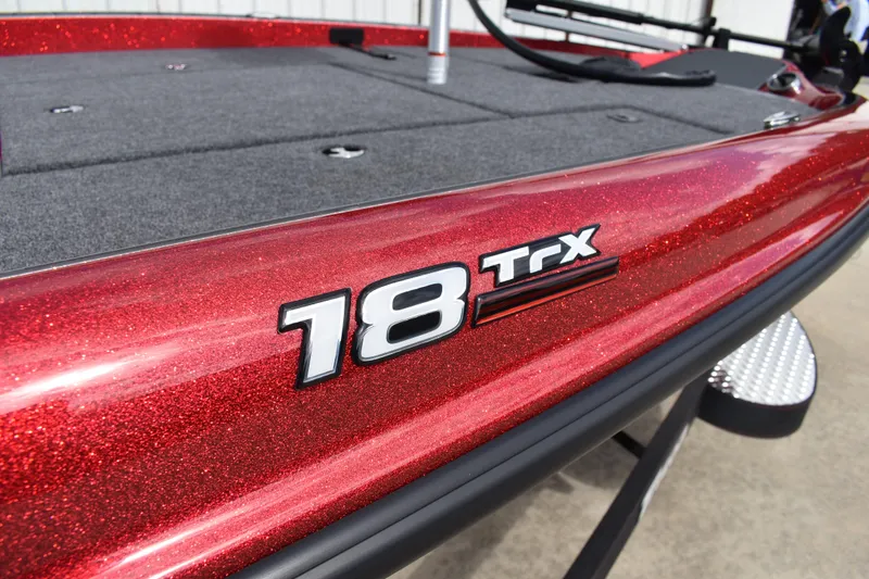 Slide: The Image of Close-up of SeaStar hydraulic steering system on 2026 Triton 18 TrX boat. - 2