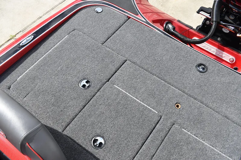 Slide: The Image of Lowrance Eagle 5 fishfinder on 2026 Triton 18 TrX dashboard, with RPM gauge visible. - 23