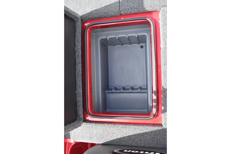 Slide: The Image of Rear view of a 2026 Triton 18 TrX boat with motor and red hull. - 24