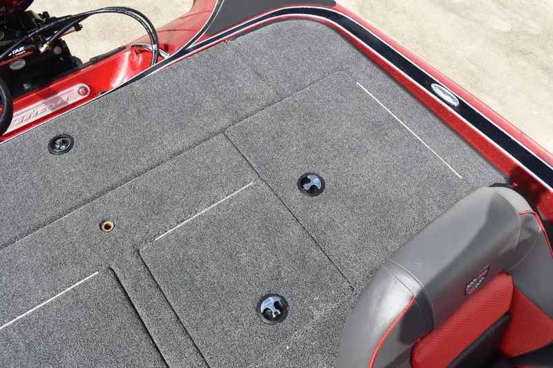 Slide: The Image of Trailer hitch and winch of 2026 Triton 18 TrX boat on concrete surface. - 25