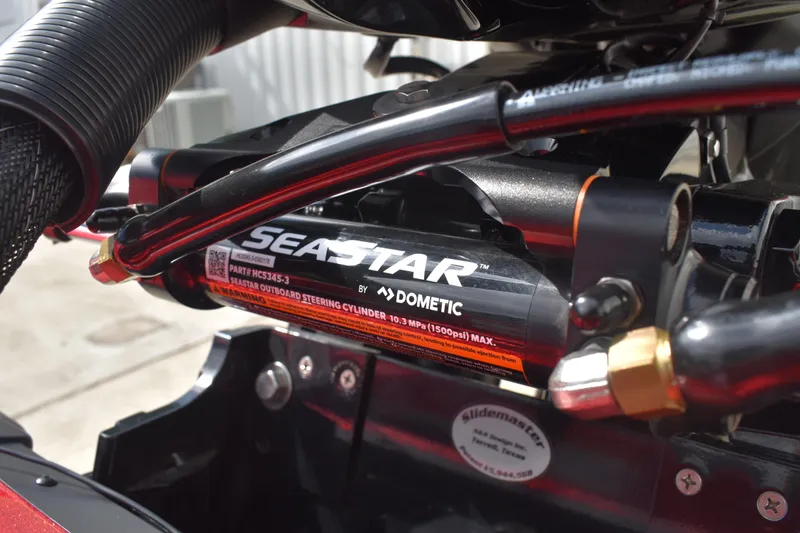 Slide: The Image of Mercury Pro XS 150 engine on 2026 Triton 18 TrX boat, reflecting sky and surroundings. - 27