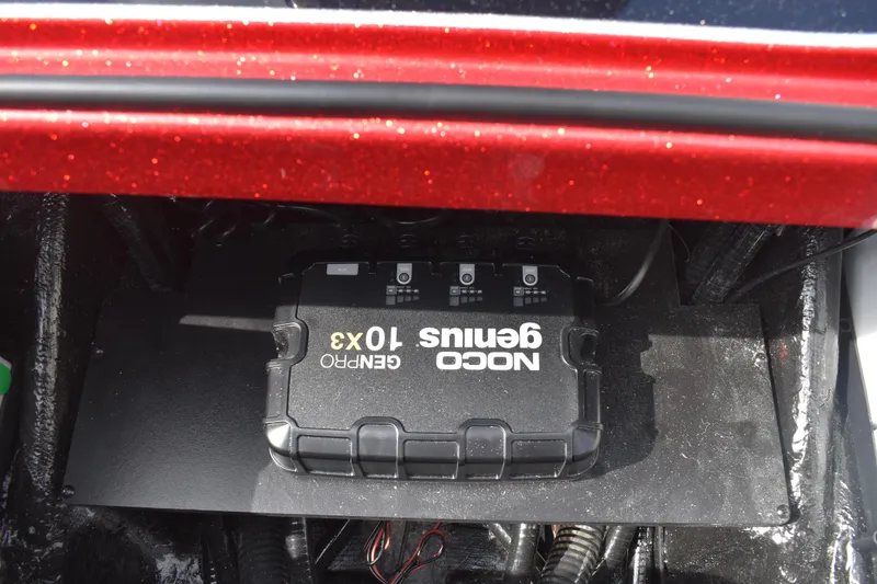 Slide: The Image of Red 2026 Triton 18 TrX boat on trailer, featuring sleek design and dual axles. - 28