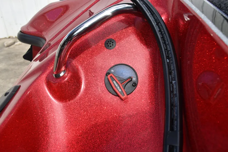 Slide: The Image of 2026 Triton 18 TrX boat's rear view with motor and red detailing. - 29