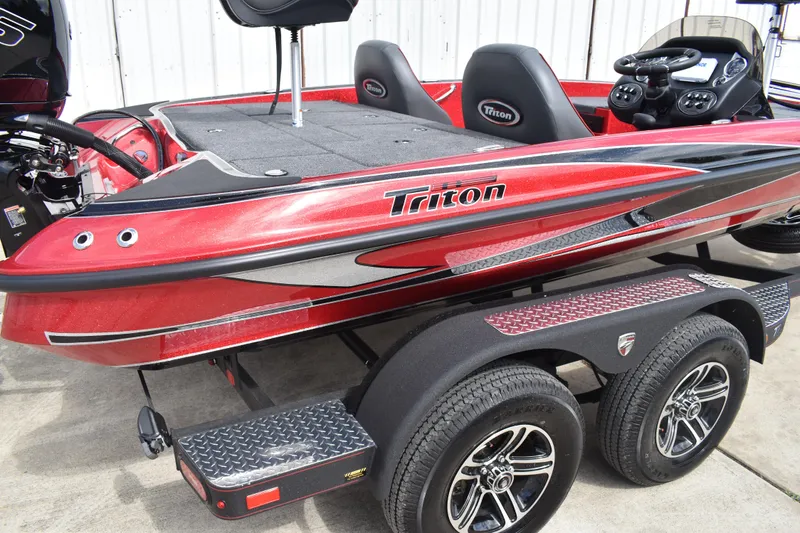 Slide: The Image of NOCO Genius GENPRO 10x3 charger in 2026 Triton 18 TrX boat compartment. - 3