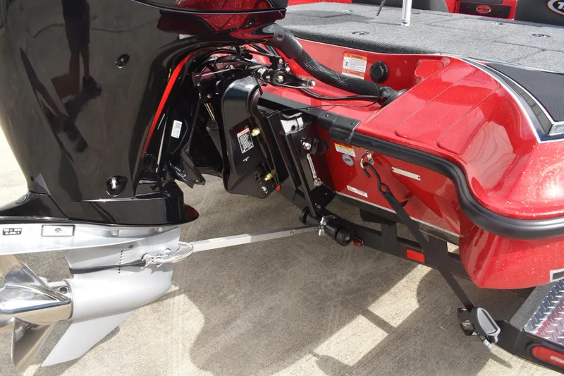 Slide: The Image of 2026 Triton 18 TrX boat interior with open storage compartments and red accents. - 4