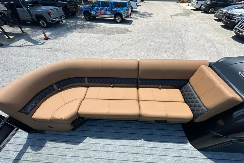 Slide: The Image of Luxurious seating on 2026 Ranger Reata 220FC boat, featuring tan and black upholstery. - 12